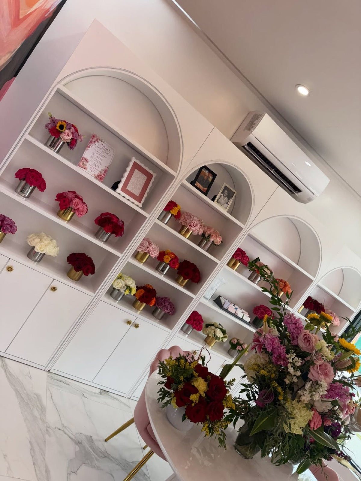 Arched flower displays inside the Legacy Flowers boutique